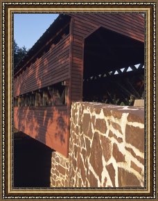 Between Geest And Marsh Framed Paintings - The Sachs Mill Bridge Spans The Marsh River by Raymond Gehman