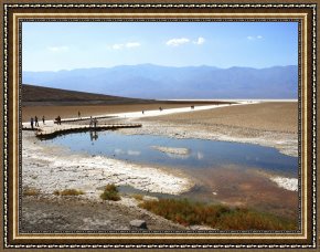 Walking The Plank Framed Paintings - Tourists Walking on Badwater Basin in Death Valley National Park Ca by Raymond Gehman