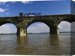 Raymond Gehman Canvas Prints - A Train Crosses The Rockville Bridge c.1902 The Longest Stone Arch Railroad Bridge in The World by Raymond Gehman