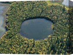Night View of a Barge And It's Tug on The Kanawha River Canvas Prints - An Aerial View of The Mackenzie River Delta by Raymond Gehman