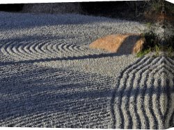 Raymond Gehman Canvas Prints - An Embedded Rock Catches The Afternoon Sun in a Raked Rock Garden by Raymond Gehman
