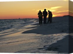 Raymond Gehman Canvas Prints - Backlit View of People Watching The Sunset From The Shoreline by Raymond Gehman