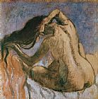 Edgar Degas Woman Combing her Hair painting
