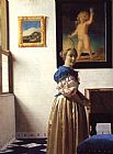 Johannes Vermeer Young Woman Standing at a Virginal painting