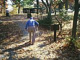 Walking The Plank Prints - An Old Man Walking a Path at The Pinnacles Picnic Area by Raymond Gehman