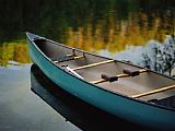 Raymond Gehman Canoe And Reflections on a Still Lake