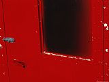 Red Doors Prints - Close View of a Bright Red Door by Raymond Gehman