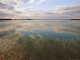 Raymond Gehman Clouds Reflected on The Smooth Waters of Iskwasum Lake