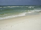Footprints Prints - Footprints Along a Sandy Beach with Gentle Surf by Raymond Gehman