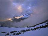 Raymond Gehman Snow And Clouds Fill The Valley at The Garden Wall in Logan Pass