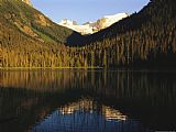 Raymond Gehman Snow Capped Mountains Reflect in a Lake
