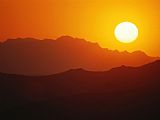 Raymond Gehman Sunset Over Silhouetted Mountain Ridges