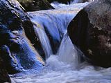 Raymond Gehman Water Cascading Over Smooth Rocks in The Whitewater River