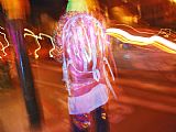 Walking The Plank Prints - Young Person in Colorful Garb Walking a San Francisco Street at Night by Raymond Gehman